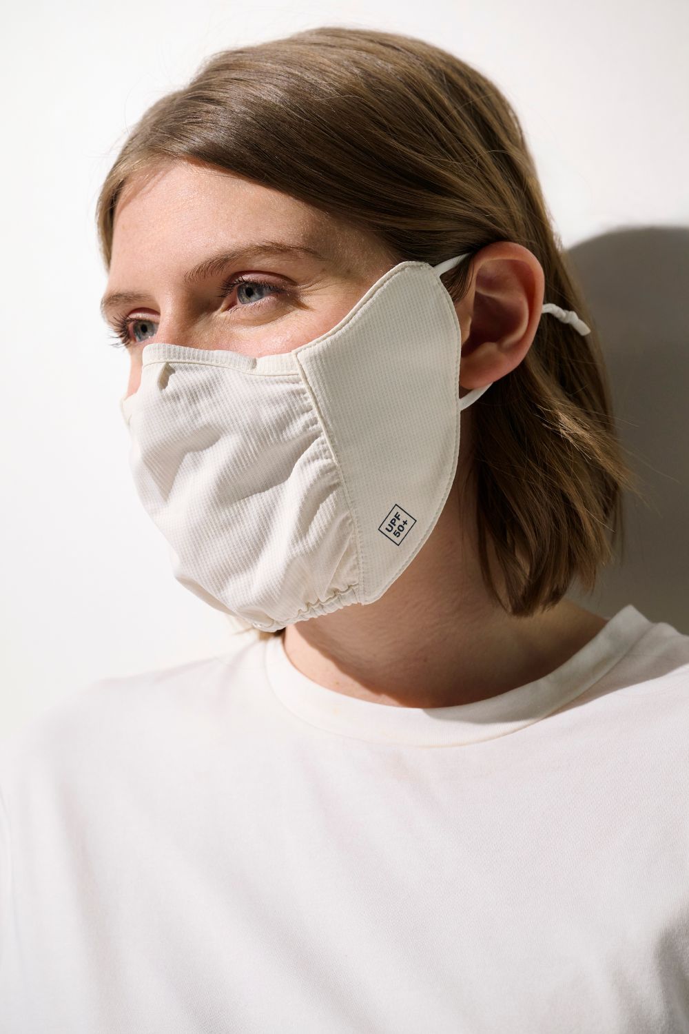 Masque anti-UV Mojave blanc pour femme, léger et respirant, idéal pour la protection solaire quotidienne.
