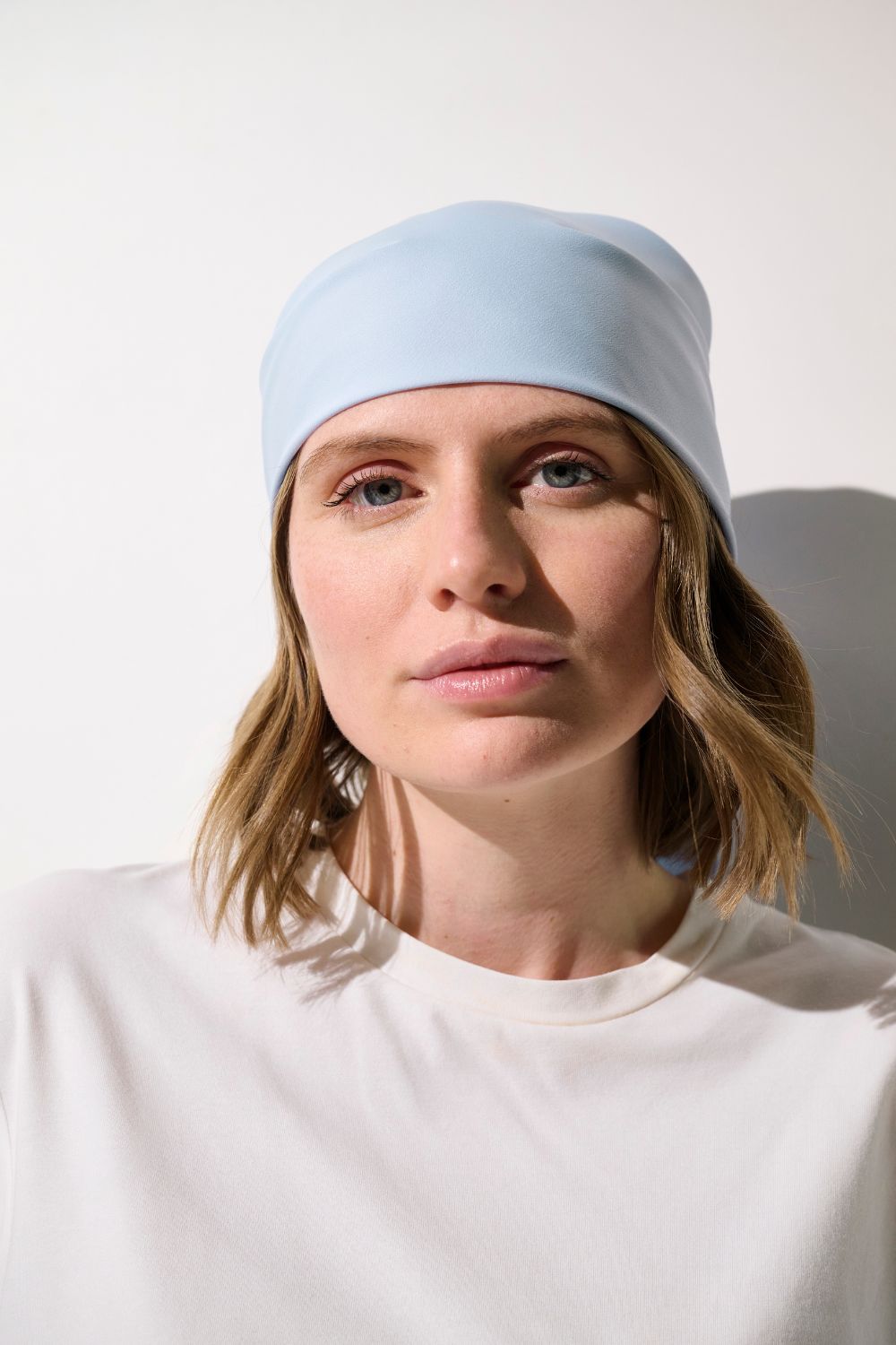 Foulard anti-UV - Positano, bleu clair, élégant, pour femme, protection solaire UPF 50+ dans un style décontracté.