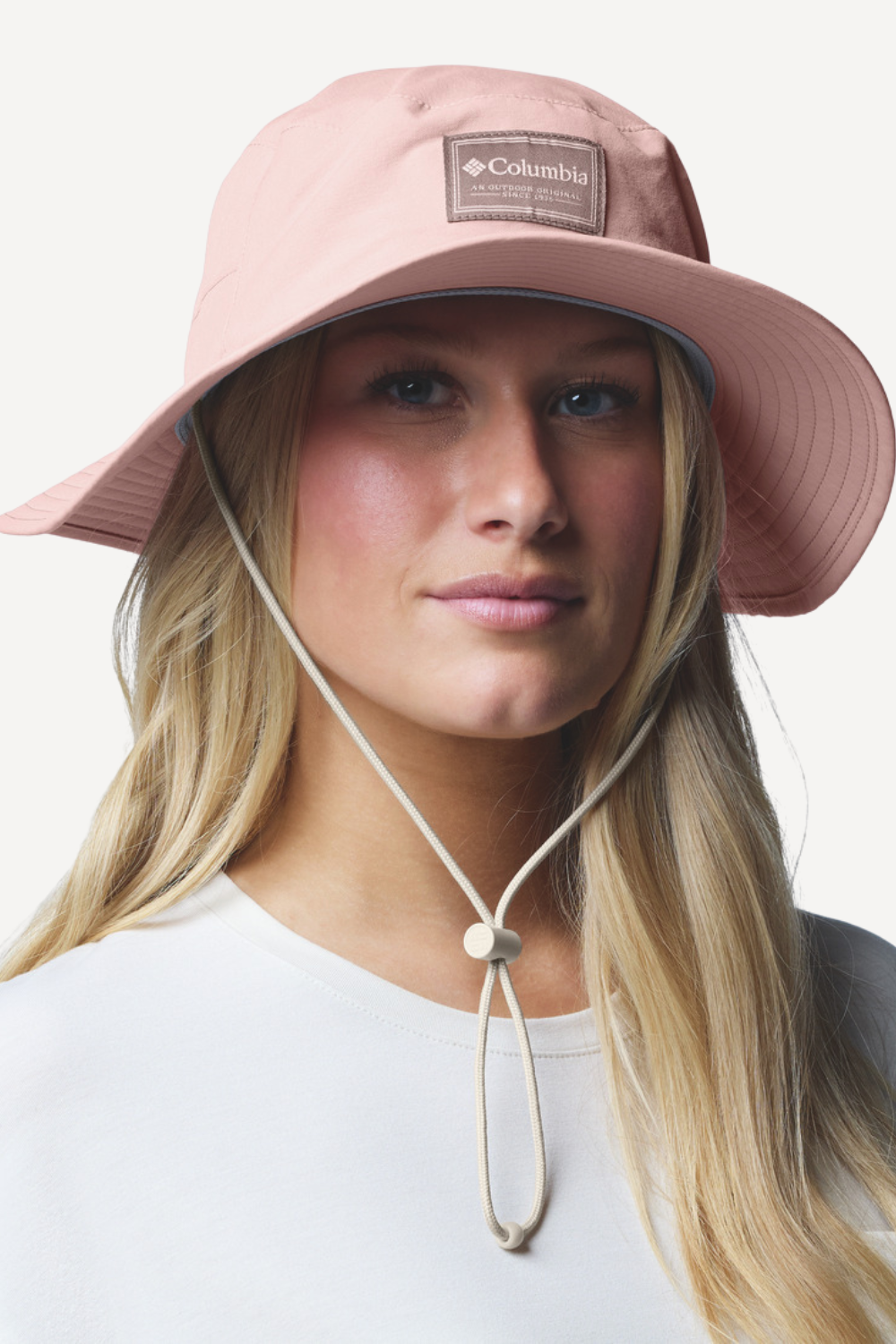 Chapeau anti-UV rose Columbia avec protection UPF 50+, parfait pour les activités en plein air sous le soleil.