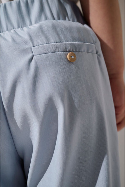 Pantalon anti-UV - Faro bleu clair pour enfant, léger et élégant avec poche bouton, idéal pour jouer au soleil.