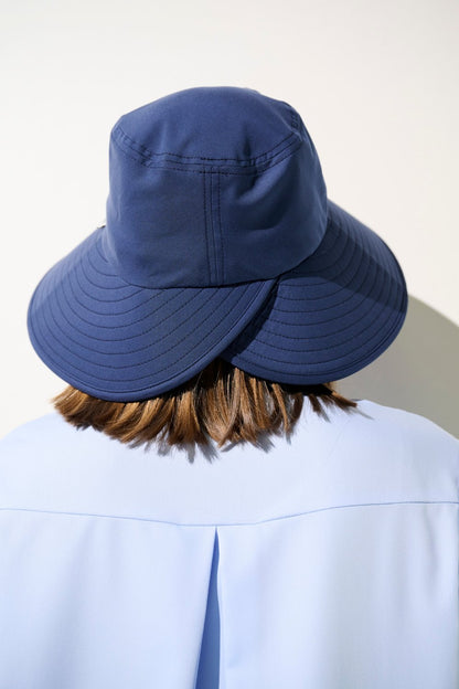 Chapeau anti-UV - Capri bleu pour femme, élégant et léger, offrant une protection solaire UPF 50+.